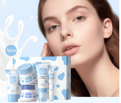 Taviona™ Clinical Milk-Barrier 5-Piece System including bottles, nipples, and accessories on a white background.