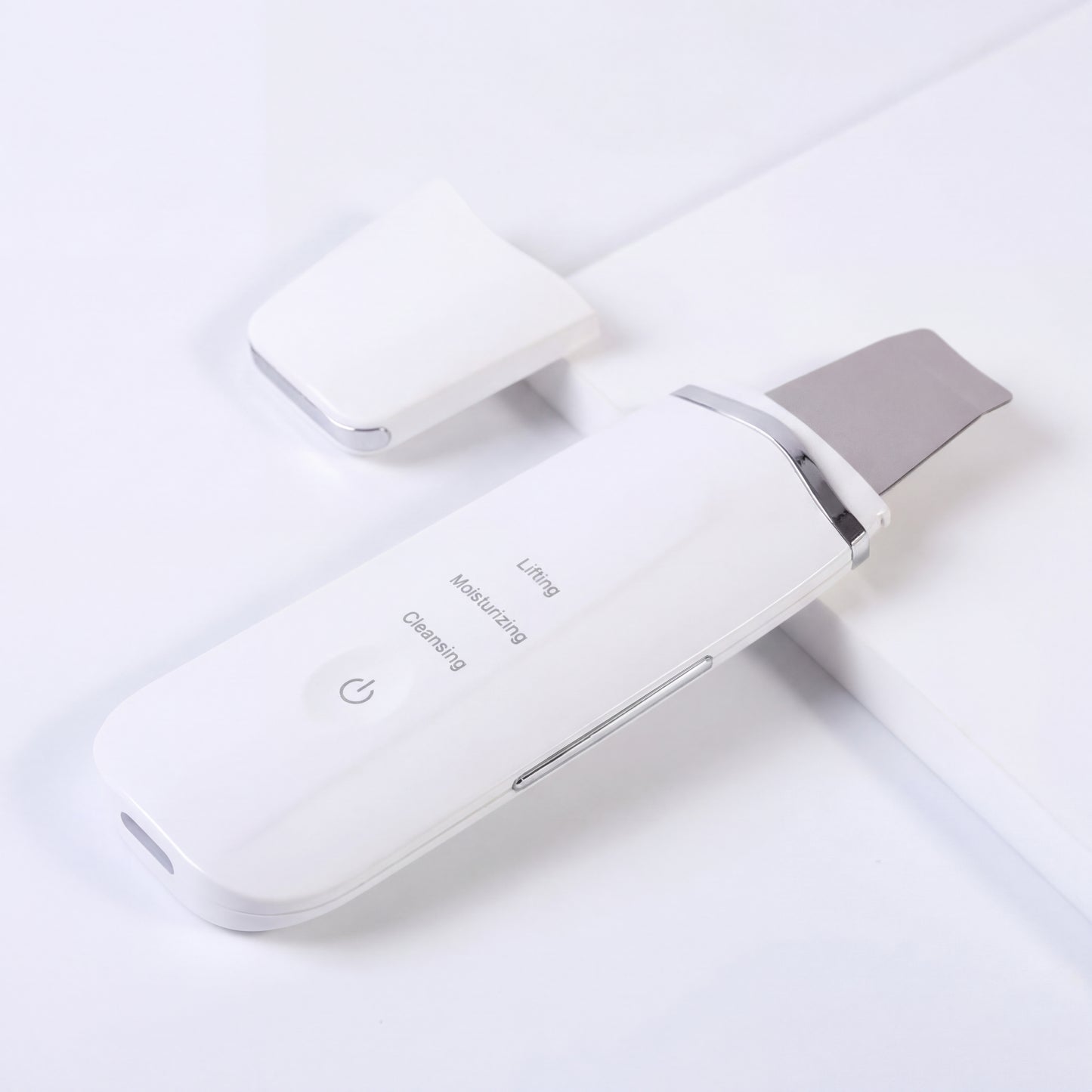 Taviona™ Deep Pore Sonic Scrubber showing a close-up of the handheld skin cleansing device with a textured brush head.